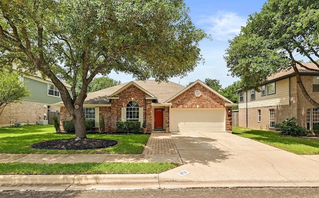 2713 Oakwood Glen Dr, Cedar Park, TX 78613 - view of front of property featuring a garage, driveway, a front yard, brick siding, and roof with shingles