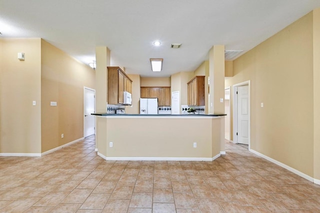 2713 Oakwood Glen Dr, Cedar Park, TX 78613 - kitchen with white appliances, dark countertops, light tile patterned flooring, baseboards, and recessed lighting