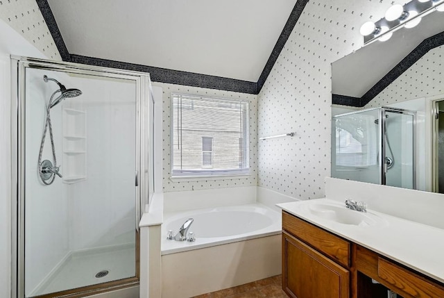 2713 Oakwood Glen Dr, Cedar Park, TX 78613 - bathroom featuring wallpapered walls, a shower stall, vaulted ceiling, a garden tub, and vanity