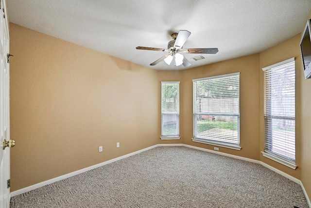 2713 Oakwood Glen Dr, Cedar Park, TX 78613 - carpeted empty room featuring healthy amount of natural light, ceiling fan, and baseboards