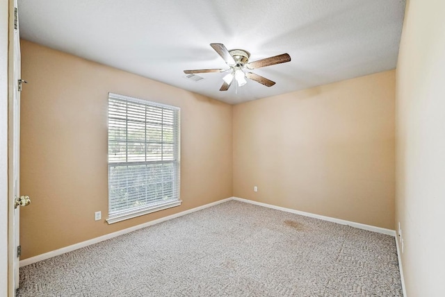 2713 Oakwood Glen Dr, Cedar Park, TX 78613 - unfurnished room with a ceiling fan, carpet floors, and baseboards