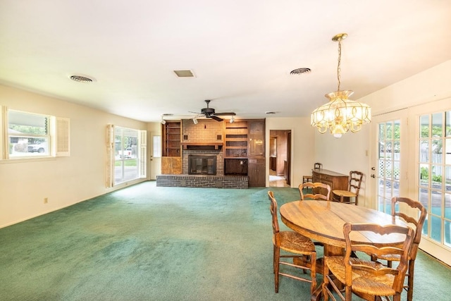 104 N Fair St, Gonzales, TX 78629 - dining space featuring ceiling fan, carpet floors, plenty of natural light, and a fireplace