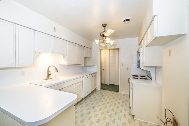 104 N Fair St, Gonzales, TX 78629 - kitchen with dishwasher, light countertops, a chandelier, and a peninsula