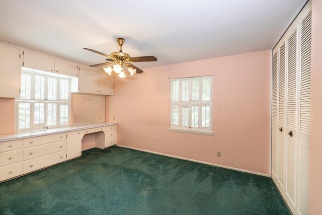 104 N Fair St, Gonzales, TX 78629 - unfurnished bedroom featuring dark colored carpet, a closet, baseboards, and ceiling fan