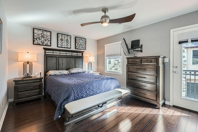 6900 E Riverside Dr Unit 6, Austin, TX 78741 - bedroom featuring dark wood-style flooring, baseboards, and a ceiling fan