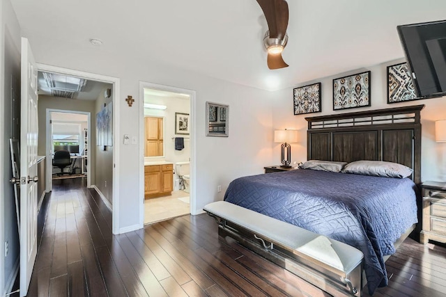 6900 E Riverside Dr Unit 6, Austin, TX 78741 - bedroom with dark wood-type flooring, ensuite bathroom, and a ceiling fan