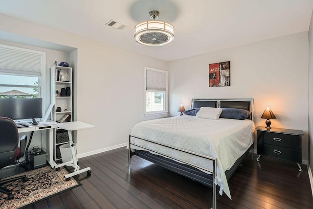 6900 E Riverside Dr Unit 6, Austin, TX 78741 - bedroom with an office area and dark wood-style floors
