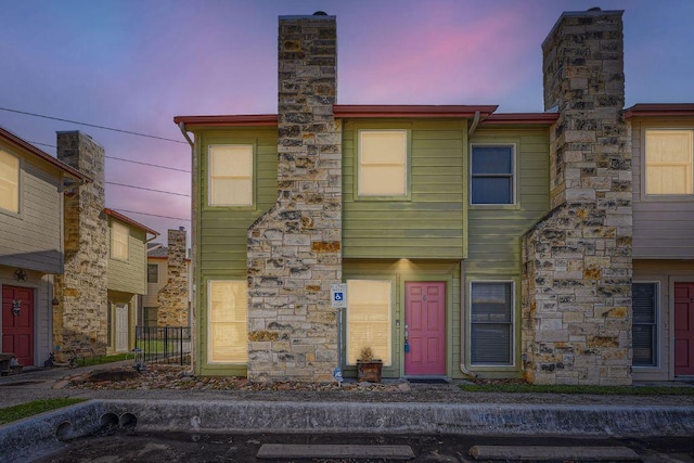 6900 E Riverside Dr Unit 6, Austin, TX 78741 - townhome / multi-family property featuring a chimney