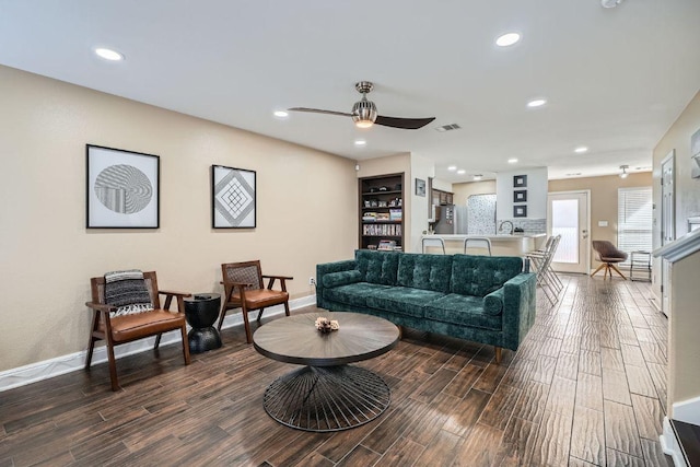 6900 E Riverside Dr Unit 6, Austin, TX 78741 - living area featuring dark wood-style floors, a ceiling fan, and recessed lighting