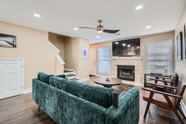 6900 E Riverside Dr Unit 6, Austin, TX 78741 - living area with a ceiling fan, wood finished floors, a fireplace, stairs, and recessed lighting