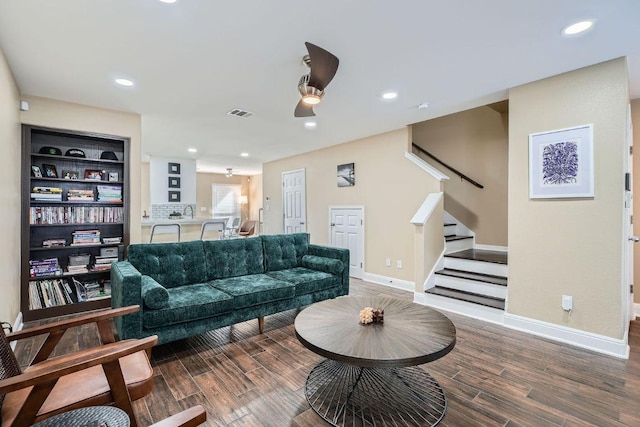 6900 E Riverside Dr Unit 6, Austin, TX 78741 - living room with stairway, wood finished floors, baseboards, a ceiling fan, and recessed lighting
