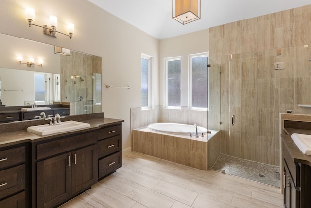 604 Germander Rd, Leander, TX 78641 - bathroom featuring vanity, a bath, a shower stall, and tile patterned flooring