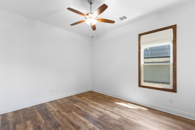 604 Germander Rd, Leander, TX 78641 - empty room with wood finished floors, ceiling fan, and baseboards