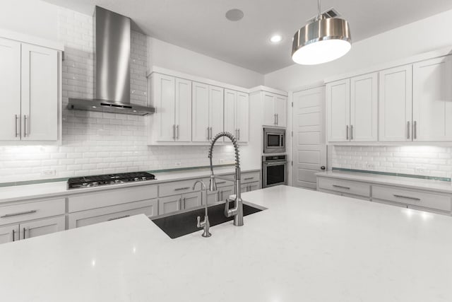 604 Germander Rd, Leander, TX 78641 - kitchen with wall chimney exhaust hood, appliances with stainless steel finishes, backsplash, a sink, and pendant lighting