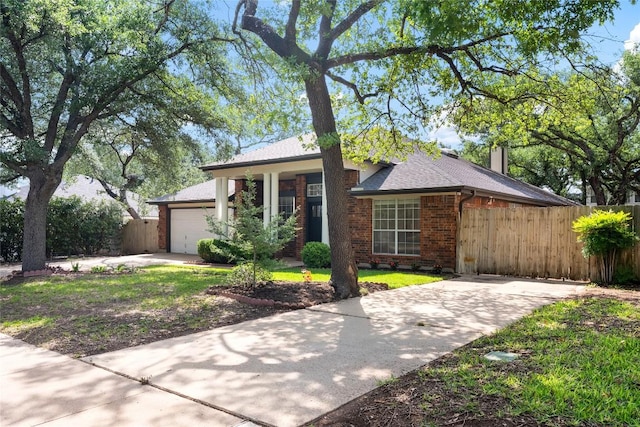 1202 Deergrove Dr, Cedar Park, TX 78613 - view of front of home with concrete driveway, an attached garage, brick siding, and a shingled roof