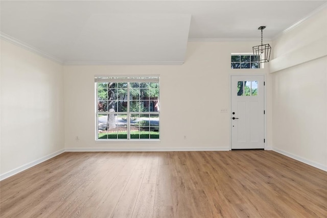 1202 Deergrove Dr, Cedar Park, TX 78613 - foyer featuring a chandelier, crown molding, light wood-style floors, plenty of natural light, and baseboards