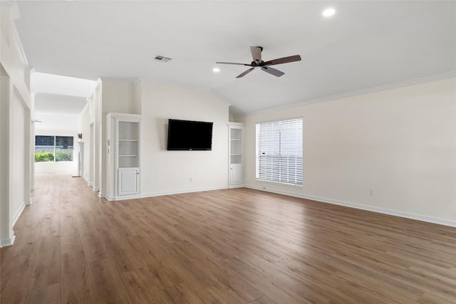 1202 Deergrove Dr, Cedar Park, TX 78613 - unfurnished living room with ceiling fan, wood finished floors, baseboards, lofted ceiling, and recessed lighting