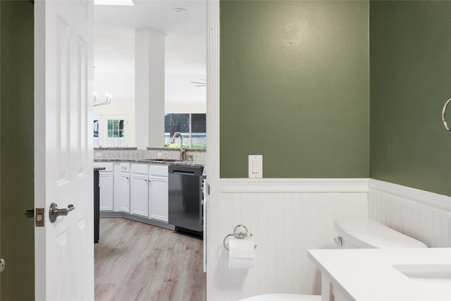 1202 Deergrove Dr, Cedar Park, TX 78613 - bathroom with toilet, wainscoting, vanity, and wood finished floors