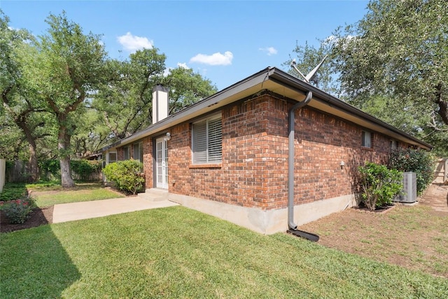 1202 Deergrove Dr, Cedar Park, TX 78613 - view of property exterior featuring a chimney and brick siding