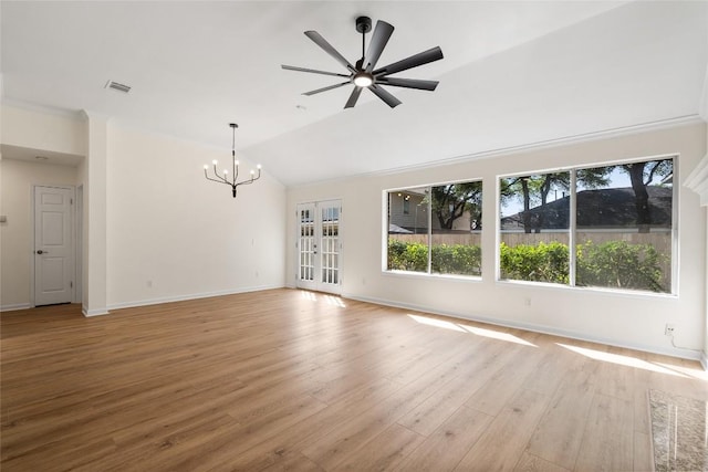 1202 Deergrove Dr, Cedar Park, TX 78613 - unfurnished living room with plenty of natural light, a chandelier, vaulted ceiling, light wood-style flooring, and baseboards