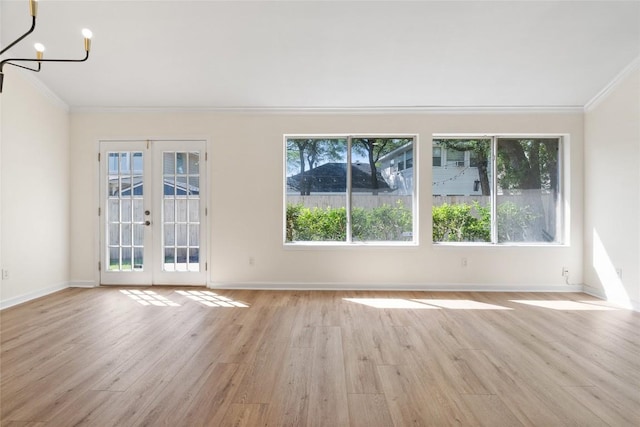 1202 Deergrove Dr, Cedar Park, TX 78613 - spare room featuring ornamental molding, light wood-style floors, french doors, baseboards, and a chandelier