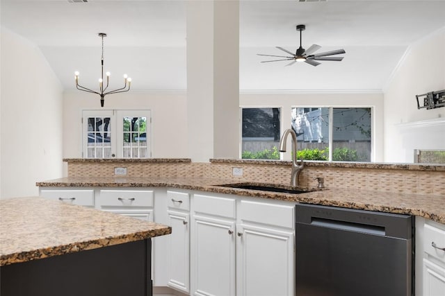 1202 Deergrove Dr, Cedar Park, TX 78613 - kitchen with dishwashing machine, a sink, backsplash, a chandelier, and ornamental molding