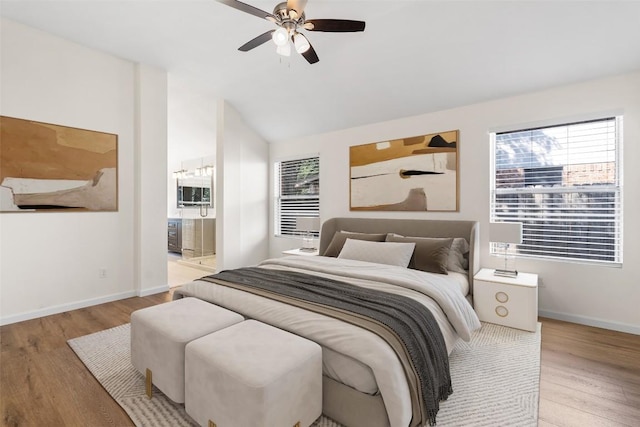 1202 Deergrove Dr, Cedar Park, TX 78613 - bedroom with wood finished floors, multiple windows, lofted ceiling, and baseboards