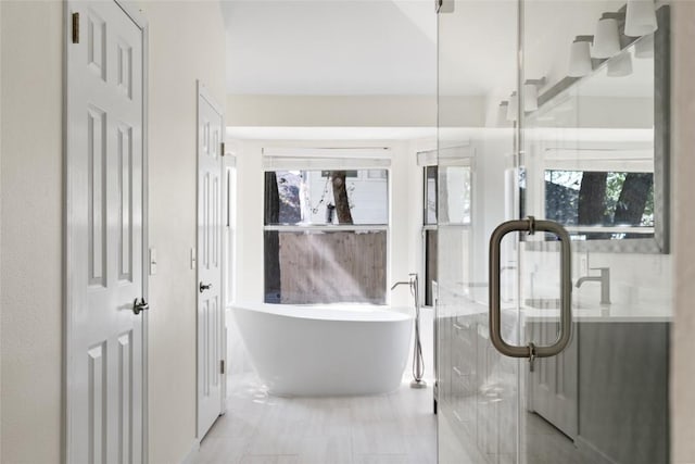 1202 Deergrove Dr, Cedar Park, TX 78613 - bathroom with a soaking tub, tile patterned flooring, and an enclosed shower