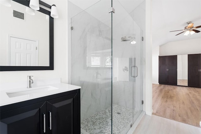 1202 Deergrove Dr, Cedar Park, TX 78613 - full bath with lofted ceiling, a marble finish shower, vanity, wood finished floors, and ceiling fan