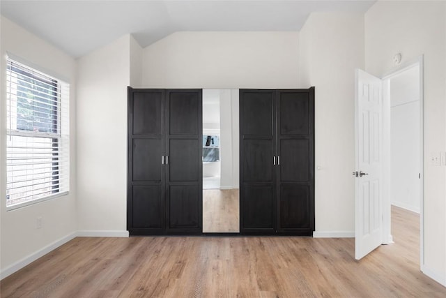 1202 Deergrove Dr, Cedar Park, TX 78613 - unfurnished bedroom featuring light wood finished floors, lofted ceiling, and baseboards