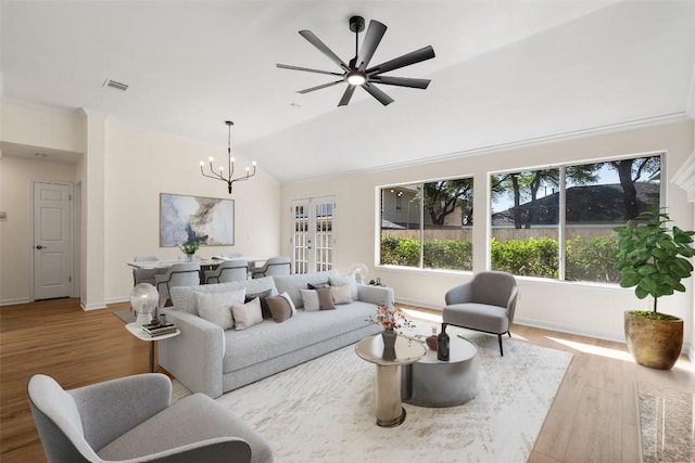 1202 Deergrove Dr, Cedar Park, TX 78613 - living area with wood finished floors, vaulted ceiling, a chandelier, baseboards, and a ceiling fan