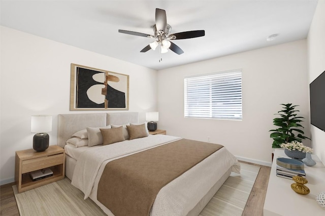 1202 Deergrove Dr, Cedar Park, TX 78613 - bedroom with light wood finished floors, baseboards, and ceiling fan