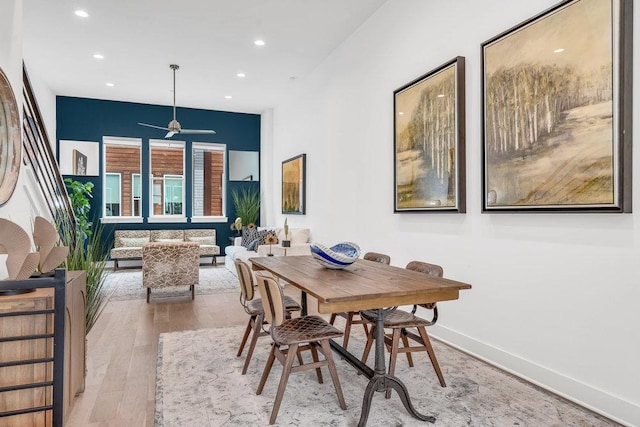 dining space with wood finished floors, recessed lighting, a ceiling fan, and baseboards