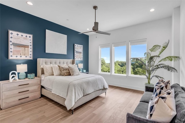bedroom featuring recessed lighting, light wood-type flooring, baseboards, and a ceiling fan
