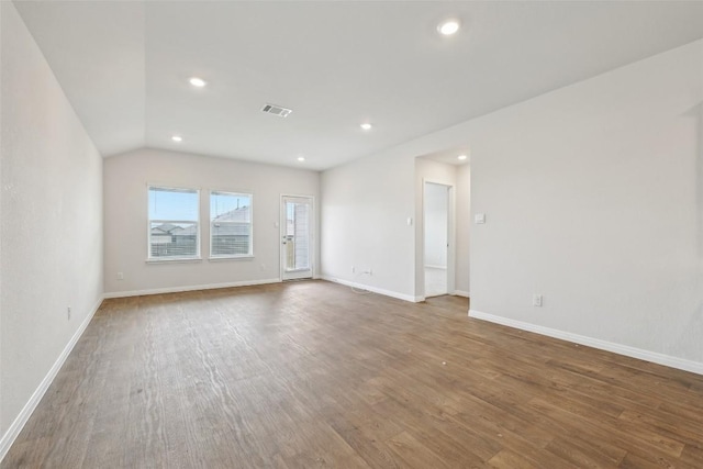 528 Evergreen Sumac Loop, Kyle, TX 78640 - unfurnished room featuring wood finished floors, recessed lighting, baseboards, and vaulted ceiling
