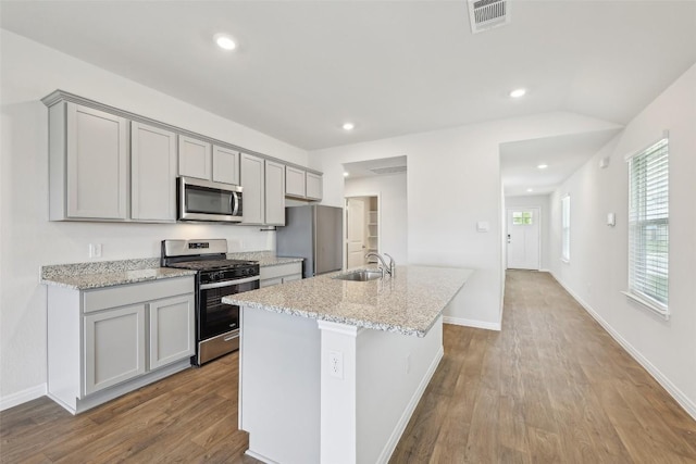 528 Evergreen Sumac Loop, Kyle, TX 78640 - kitchen with stainless steel appliances, gray cabinets, a sink, a kitchen island with sink, and recessed lighting