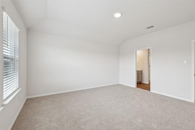 528 Evergreen Sumac Loop, Kyle, TX 78640 - spare room featuring carpet flooring, vaulted ceiling, baseboards, and recessed lighting