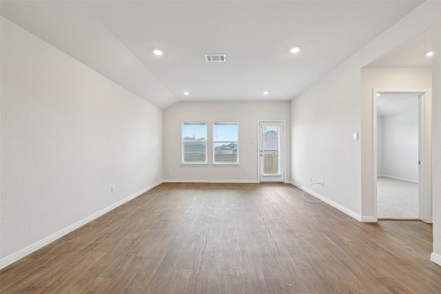 528 Evergreen Sumac Loop, Kyle, TX 78640 - spare room with wood finished floors, baseboards, recessed lighting, and lofted ceiling