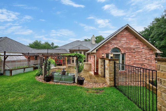 18004 Rosebud Pl, Round Rock, TX 78681 - rear view of property featuring an exterior structure, brick siding, an outdoor structure, a patio area, and a chimney