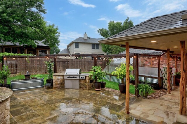 18004 Rosebud Pl, Round Rock, TX 78681 - view of patio / terrace featuring an exterior structure, a fenced backyard, area for grilling, an outdoor kitchen, and an outbuilding