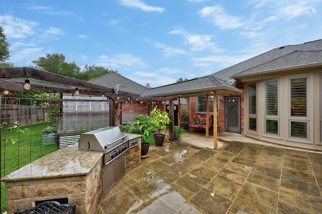 18004 Rosebud Pl, Round Rock, TX 78681 - view of patio with area for grilling, exterior kitchen, and a pergola
