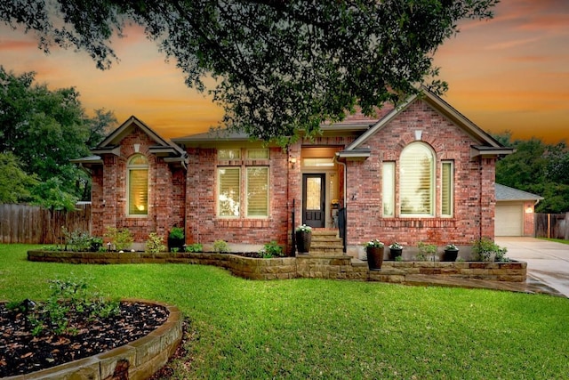 18004 Rosebud Pl, Round Rock, TX 78681 - view of front of house with brick siding, driveway, and a garage