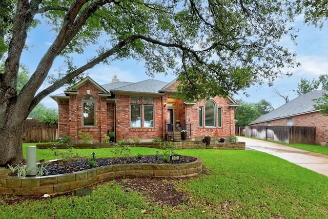 18004 Rosebud Pl, Round Rock, TX 78681 - view of front of house featuring brick siding, a chimney, and driveway