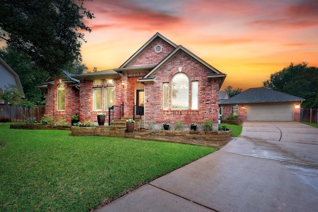 18004 Rosebud Pl, Round Rock, TX 78681 - view of front facade featuring an outdoor structure, brick siding, a detached garage, and concrete driveway