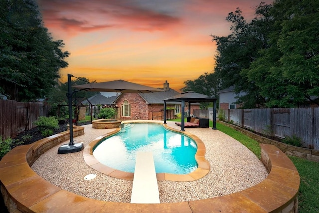 18004 Rosebud Pl, Round Rock, TX 78681 - view of swimming pool featuring a gazebo, a fenced backyard, a diving board, and a pool with connected hot tub