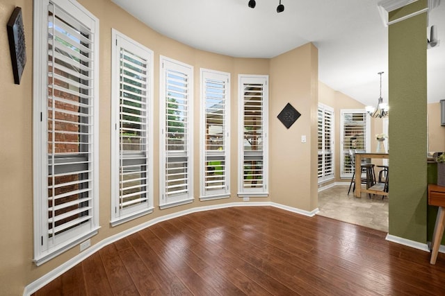 18004 Rosebud Pl, Round Rock, TX 78681 - entryway featuring wood-type flooring, baseboards, and a chandelier