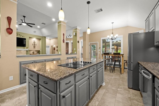 18004 Rosebud Pl, Round Rock, TX 78681 - kitchen featuring gray cabinets, appliances with stainless steel finishes, vaulted ceiling, a center island, and ceiling fan