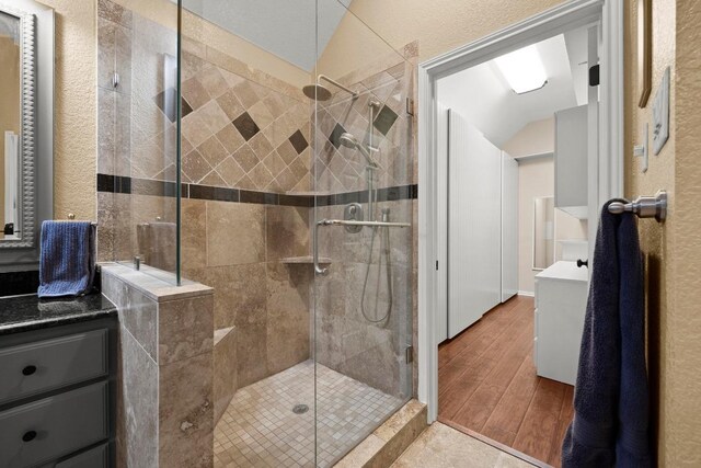 18004 Rosebud Pl, Round Rock, TX 78681 - full bath featuring wood finished floors, a stall shower, and vanity