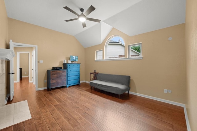 18004 Rosebud Pl, Round Rock, TX 78681 - living area featuring ceiling fan, wood finished floors, baseboards, and lofted ceiling