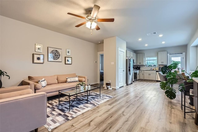 17301 Leafroller Dr Unit A, Pflugerville, TX 78660 - living area featuring ceiling fan, light wood-style floors, recessed lighting, and baseboards